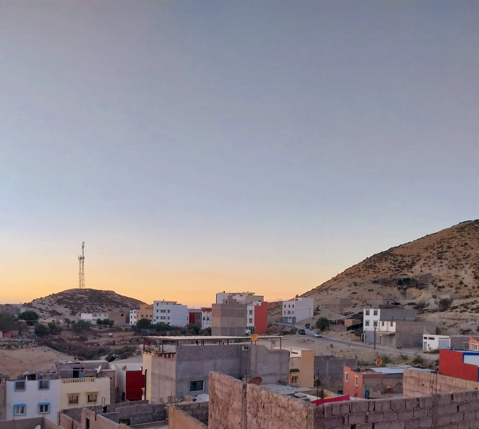 Evening light over the rooftops and hills